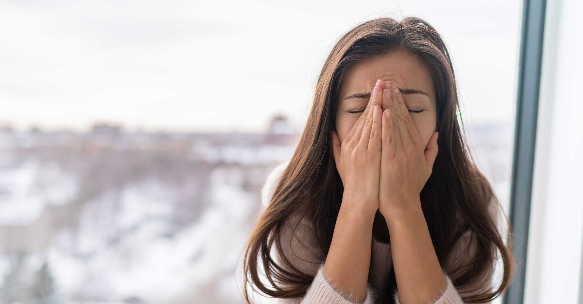 Woman covering face